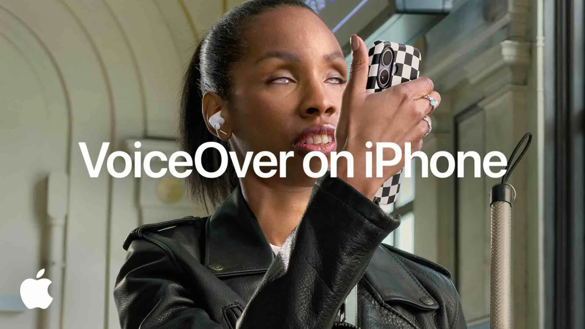 Apple preview image showing VoiceOver with Apple Intelligence describing a real-world camera view on iPhone
