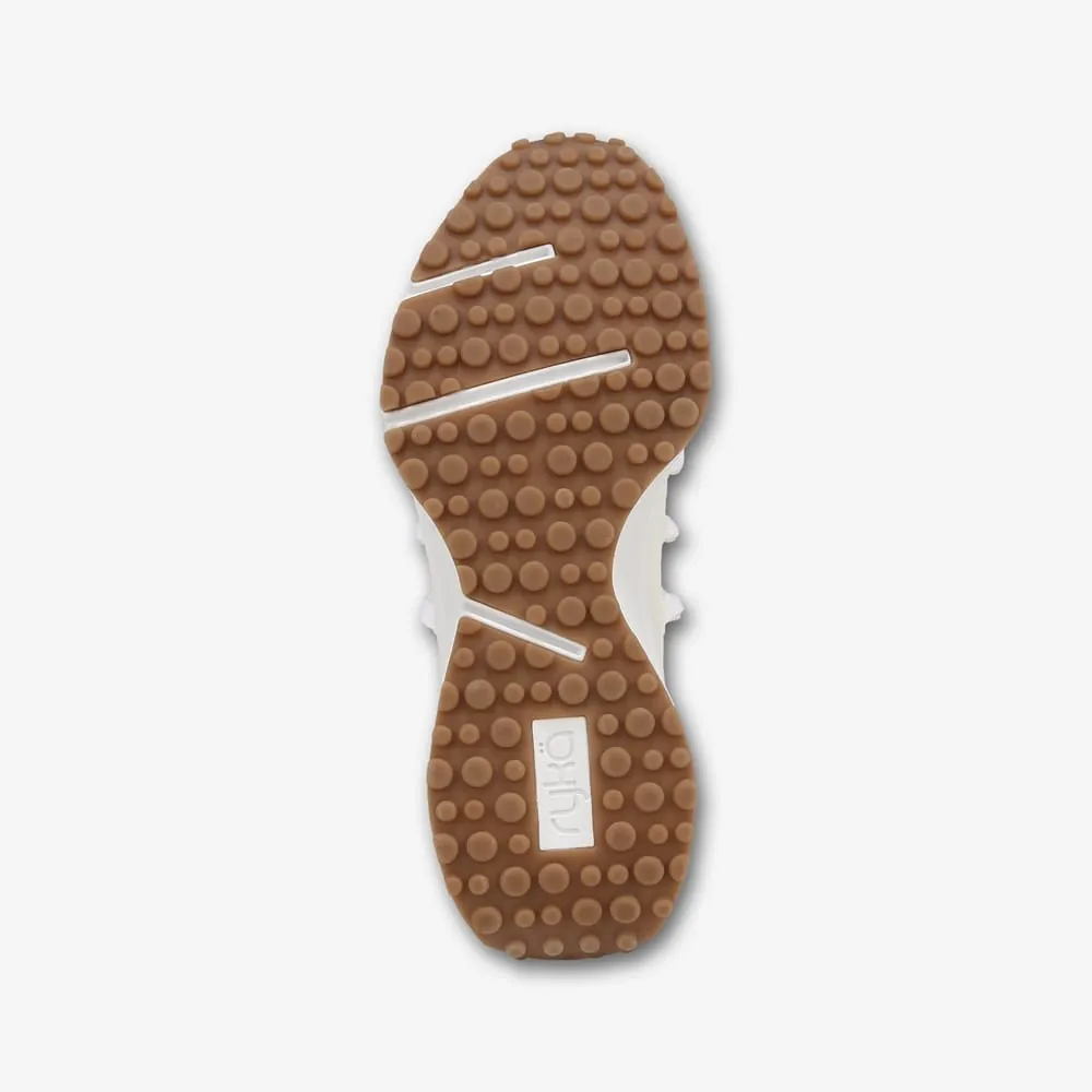 Bottom view of a Ryka Jumpstart Lace Slip-On sneaker showing rubber outsole tread
