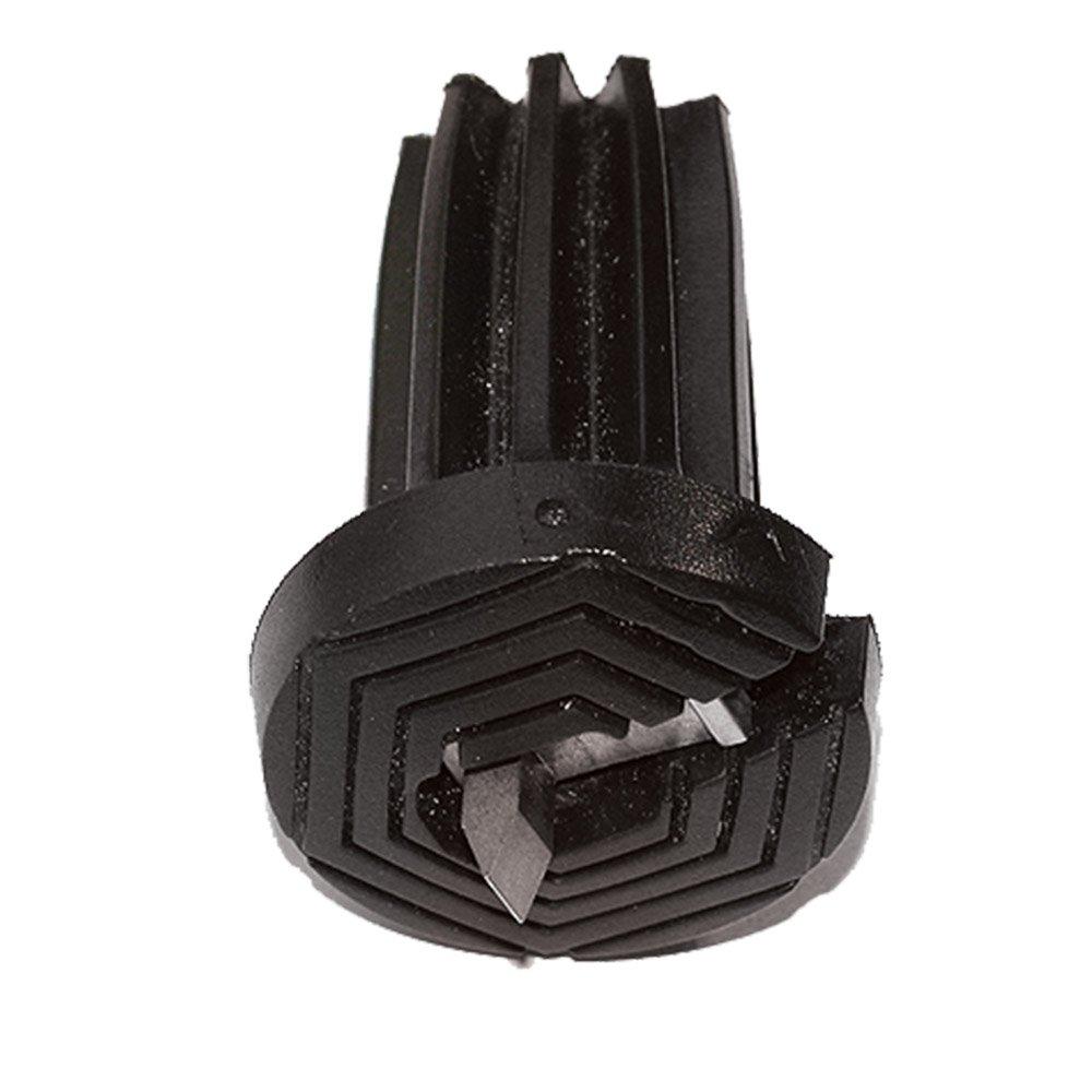 Metal ice gripper attachment with prongs installed on the bottom of a wooden walking cane