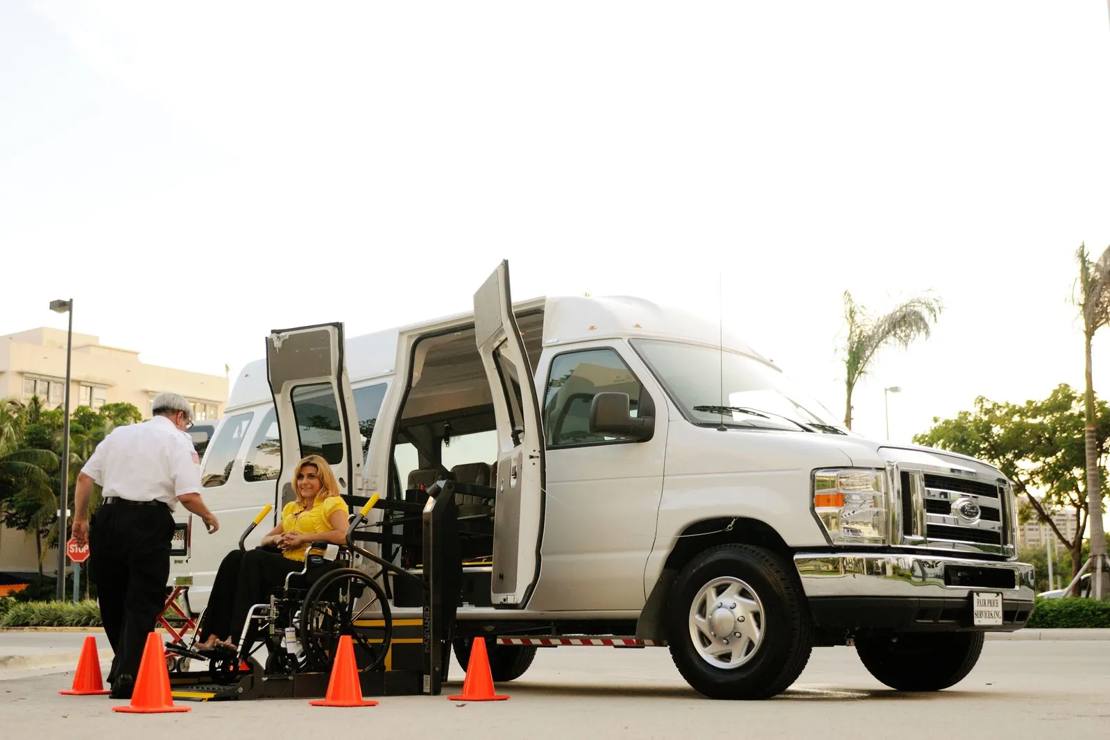 Wheelchair-accessible vehicle with a boarding ramp extended at the curb