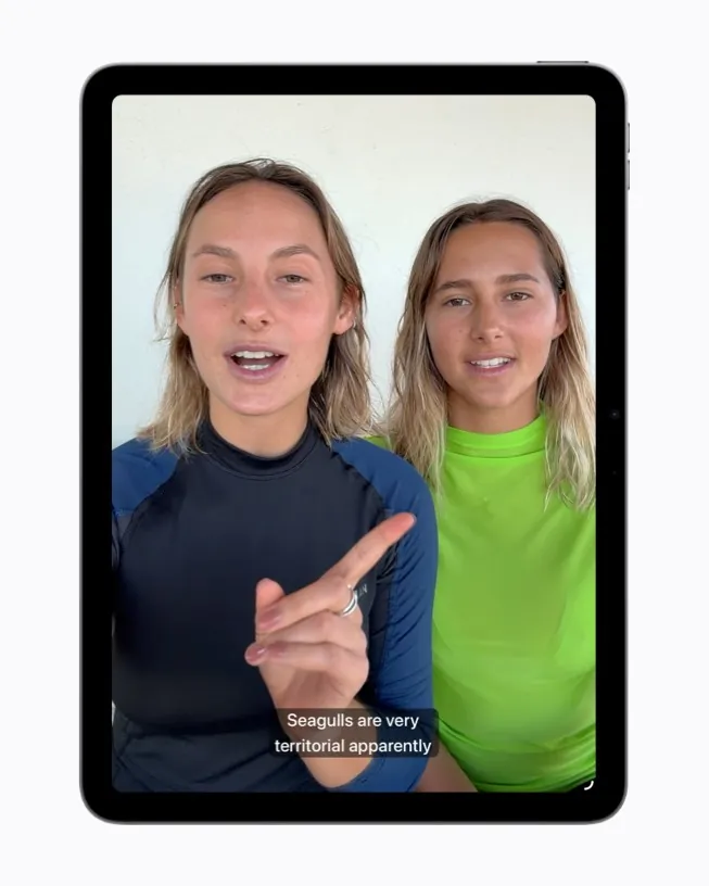 Apple preview image of generated subtitles appearing on an iPhone screen during video playback