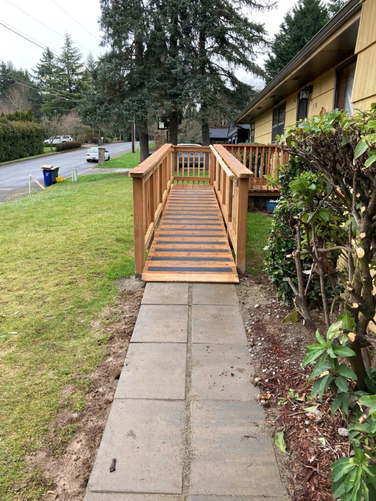 A wooden wheelchair ramp leading up to a home entrance, built by Habitat for Humanity for Anna Bowlby in Portland, Oregon.