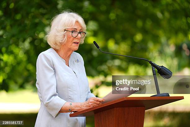 Queen Camilla speaking at a podium at the Royal Osteoporosis Society 40th anniversary reception