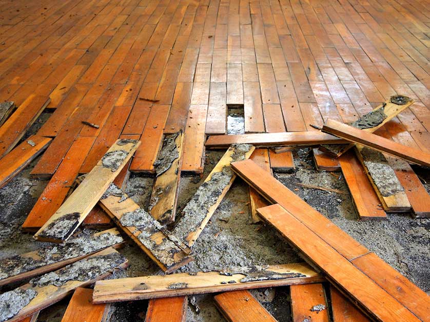 Warped and buckled hardwood floor after flood damage