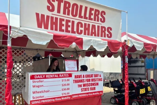 Mobility scooter parked on a paved pathway at the Wisconsin State Fair