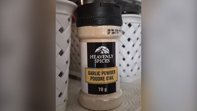 Recalled Heavenly Spices Garlic Powder jar with the front label visible