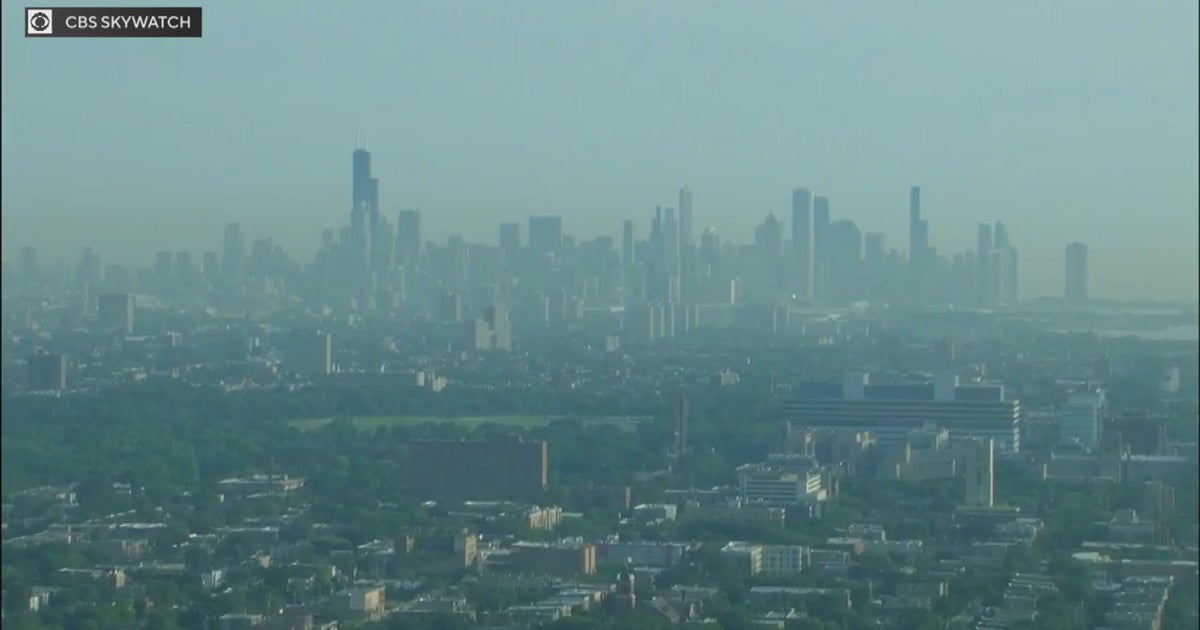Chicago skyline obscured by orange-gray wildfire smoke haze in July 2026