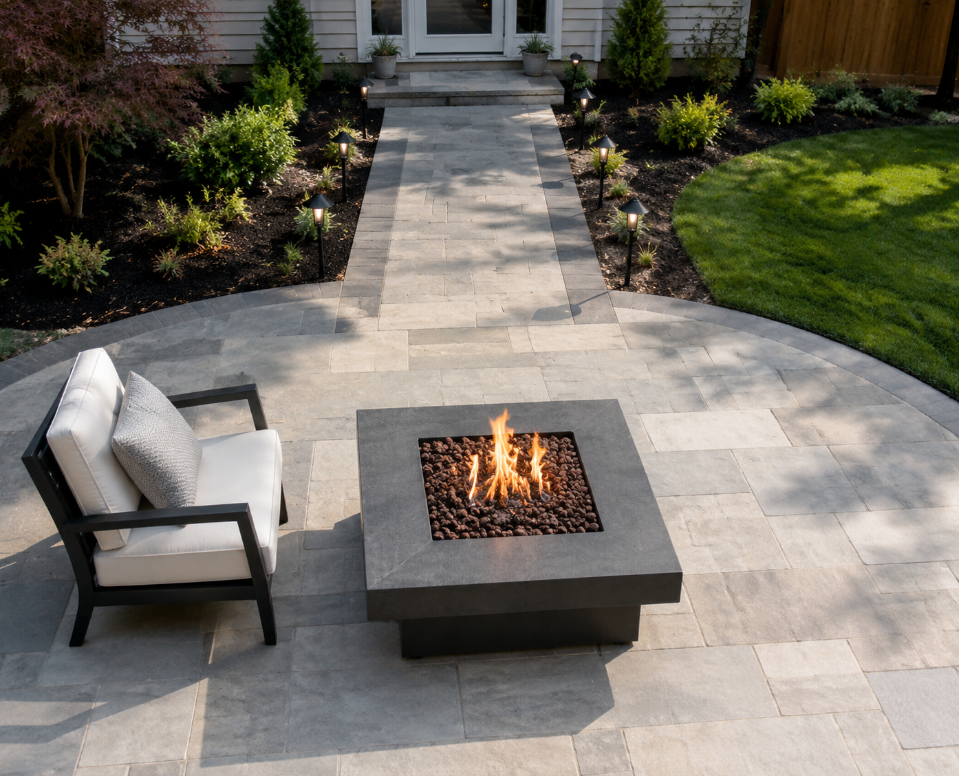 Top-down fire pit safety layout with a gas fire pit, sturdy armchair, wide clear walkway, and path lights
